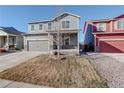 Two-story house with gray siding, attached garage, and front porch at 341 Maple St, Bennett, CO 80102