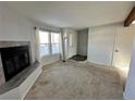 Living room with fireplace and view of entryway at 17136 E Tennessee Dr, Aurora, CO 80017