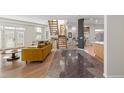 Bright living room with hardwood floors, fireplace and large windows at 175 Harrison St, Denver, CO 80206