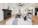 Bright living room with fireplace and comfortable seating at 2504 Zenobia St, Denver, CO 80212