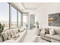 Light-filled living room with modern furniture and balcony access at 4200 W 17Th Ave # 618, Denver, CO 80204