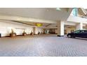 Elegant entrance to The Ritz Carlton Residences with a porte cochere and meticulously landscaped grounds at 1891 Curtis St # 1613, Denver, CO 80202