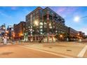 Brick building exterior at night, located on a city corner at 1890 Wynkoop St # 806, Denver, CO 80202