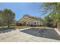 A metal carport providing shade and parking for a single-story home at 5523 Tejon St, Denver, CO 80221