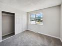 Bright bedroom with ample closet space and neutral carpeting at 9065 Cody Ct, Broomfield, CO 80021