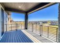 Spacious deck with modern railing offering scenic neighborhood views at 8669 Middle Fork St, Littleton, CO 80125