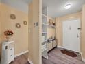 Bright condo entryway with built-in shelving at 2281 S Vaughn Way # 111A, Aurora, CO 80014