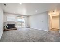 Spacious living room with fireplace and access to a balcony at 519 Wright St # 304, Lakewood, CO 80228