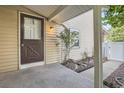 Covered entryway to a townhome with a small patio at 2466 S Vaughn Way # B, Aurora, CO 80014
