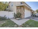 Exterior view of a townhome with a walkway and gate at 2466 S Vaughn Way # B, Aurora, CO 80014