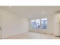 Bright dining room with light hardwood floors and large windows at 14554 W 91St Dr # A, Arvada, CO 80005