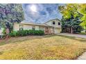 House exterior showcasing a well-maintained lawn at 1550 S Telluride St, Aurora, CO 80017