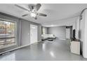 Spacious living room with gray walls and light flooring at 1550 S Telluride St, Aurora, CO 80017