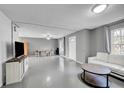 Open living area featuring a white couch and coffee table at 1550 S Telluride St, Aurora, CO 80017