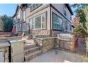 Outdoor kitchen area with stainless steel appliances and stone countertops at 5033 Silver Feather Way, Broomfield, CO 80023