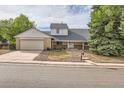 House with a two car garage and well maintained yard at 3777 S Walden St, Aurora, CO 80013