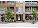 Building entrance with outdoor seating area and street view at 1610 Little Raven St # 209, Denver, CO 80202