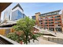 Modern urban building with city views and walking paths at 1610 Little Raven St # 209, Denver, CO 80202