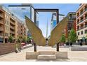 Large bronze angel wings sculpture in modern urban setting at 1610 Little Raven St # 209, Denver, CO 80202