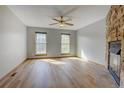 Bright living room with wood floors and a stone fireplace at 1699 S Trenton St # 77, Denver, CO 80231