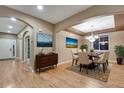 Bright dining room features hardwood floors and a chandelier at 17123 E 102Nd Ave, Commerce City, CO 80022