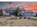 Two story home with deck, attached garage, and landscaped yard at 43400 Somerset Ct, Elizabeth, CO 80107