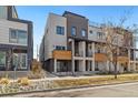 Modern three-story townhome with inviting front porch and walkway at 3830 Jason St # 4, Denver, CO 80211