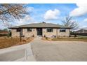 Ranch style home with a landscaped front yard at 6690 S Sheridan Blvd, Littleton, CO 80123