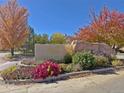 Community entrance with landscaping and signage at 8547 Gold Peak Dr # G, Highlands Ranch, CO 80130