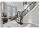 Grand entry with a curved staircase and high ceilings at 7587 Wright Ct, Arvada, CO 80005