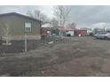 Mobile home with spacious yard and detached garage at 3440 W 66Th Ave, Denver, CO 80221