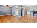 Dining room with hardwood floors and built-in shelving at 1626 S Sheridan Blvd, Denver, CO 80232