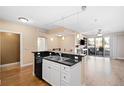 Modern kitchen with island, stainless steel appliances, and hardwood floors at 9019 E Panorama Cir # D211, Centennial, CO 80112