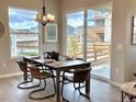 Bright dining room with large sliding glass doors leading to the backyard at 16707 Greyhawk Dr, Monument, CO 80132