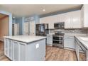 Modern kitchen with an island and stainless steel appliances at 4689 Spinning Wheel Dr, Brighton, CO 80601