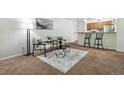 Open living room with kitchen views and neutral decor at 8813 Colorado Blvd # 207, Thornton, CO 80229