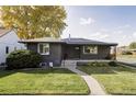 Exterior view of a renovated ranch home with a spacious lawn at 2259 Osceola St, Denver, CO 80212