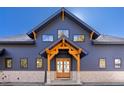 Luxury home exterior with stone accents and mountain views at 13455 S Resort Dr, Conifer, CO 80433