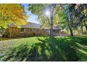 Stone ranch house with spacious backyard and mature trees at 4041 S Dexter St, Cherry Hills Village, CO 80113