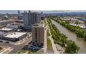 Aerial view of building near riverfront, showcasing urban surroundings at 3575 Chestnut Pl # 704, Denver, CO 80216