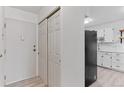 Entryway with closet and view into kitchen at 595 S Alton Way # 1C, Denver, CO 80247