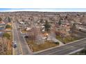 Wide shot of the property and surrounding neighborhood at 8995 Grandview Ave, Arvada, CO 80002