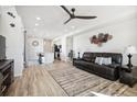 Spacious living room with hardwood floors and open concept design at 60 S Trussville St, Aurora, CO 80018