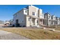 Modern two-story home with attached two-car garage and landscaped yard at 60 S Trussville St, Aurora, CO 80018