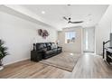 Bright and airy living room with hardwood floors and lots of natural light at 60 S Trussville St, Aurora, CO 80018