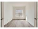 Bright and airy home office with hardwood floors at 2948 S Quartz St, Morrison, CO 80465