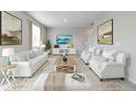 Bright and airy living room featuring a neutral color palette and plush furniture at 6542 12Th St, Frederick, CO 80530