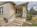 Side view of a charming bungalow with a covered porch at 3637 Lowell Blvd, Denver, CO 80211