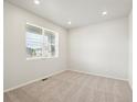 Bright bedroom with carpet flooring and large window at 9119 Pitkin St, Commerce City, CO 80022