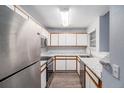 Kitchen with stainless steel appliances and granite countertops at 5775 W Atlantic Pl # 303, Lakewood, CO 80227